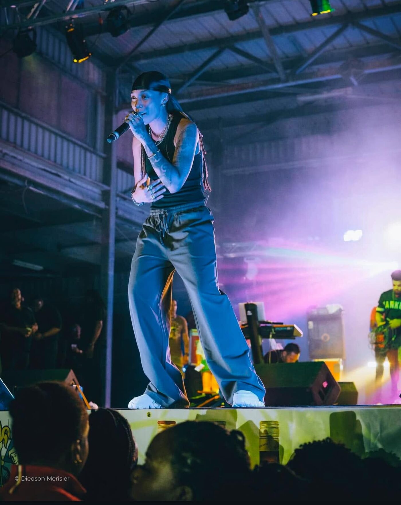Artist performing under stage lights